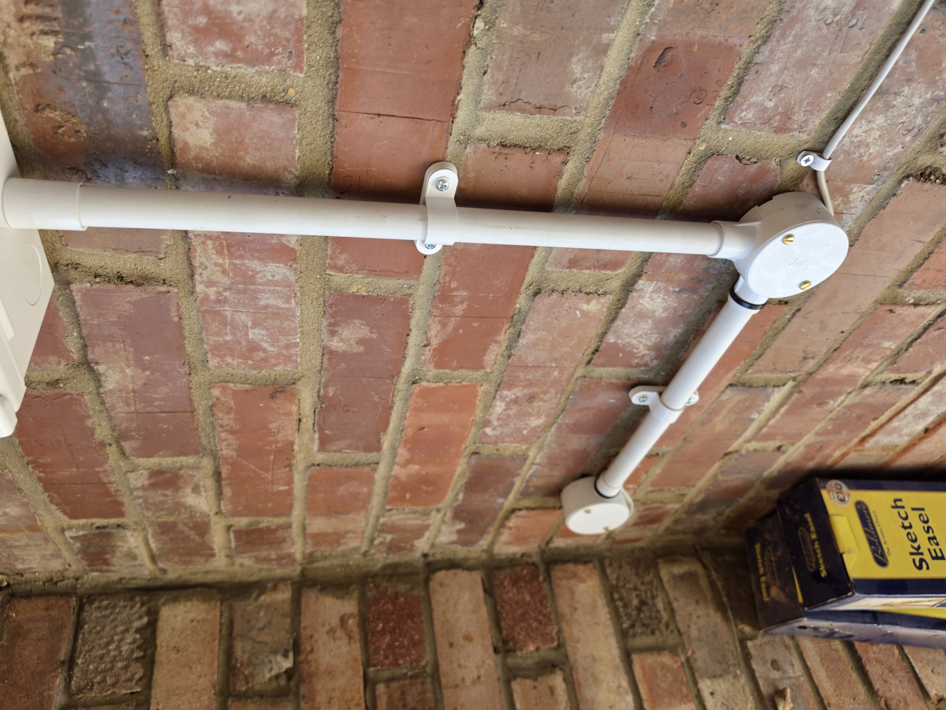 Surface-mounted conduit for residential EV charger installation