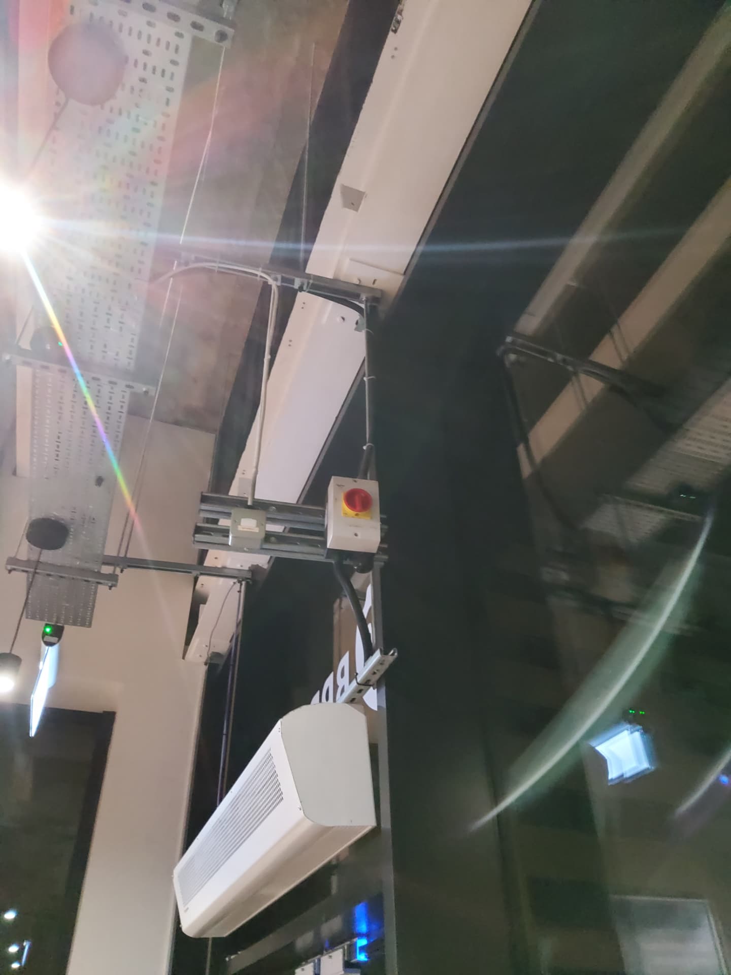 Local rotary isolator and supply cabling feeding the new over-door heater at high level.