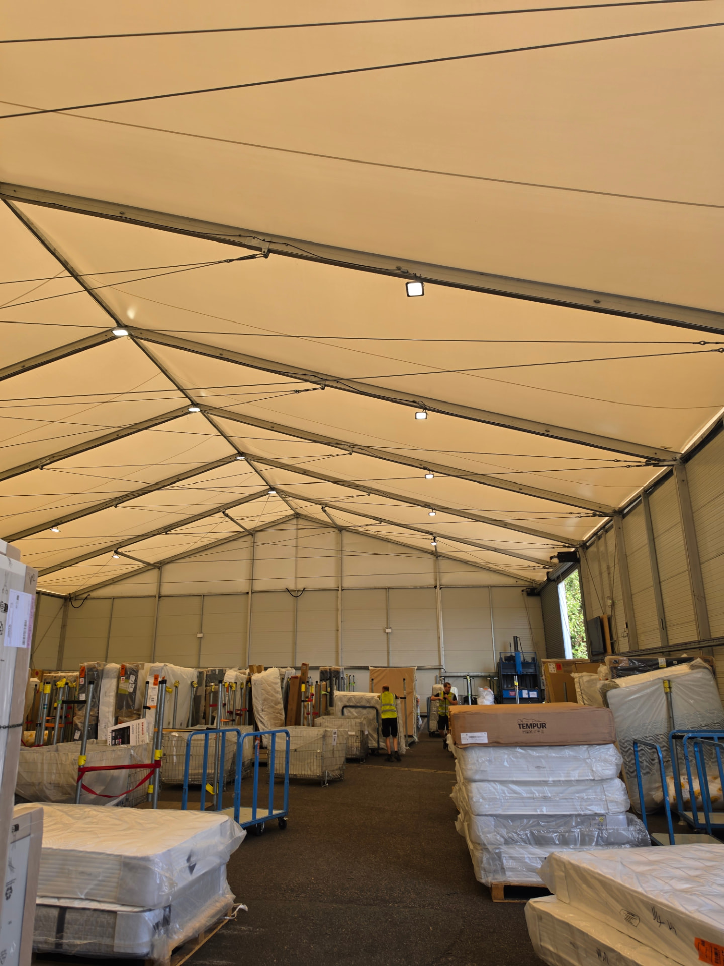 View down the distribution warehouse with the roof lighting illuminated.